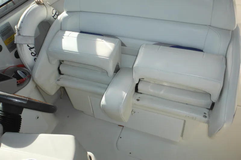 Slide: The Image of 2003 Formula 280 Bowrider interior with white leather seating and steering wheel. - 35