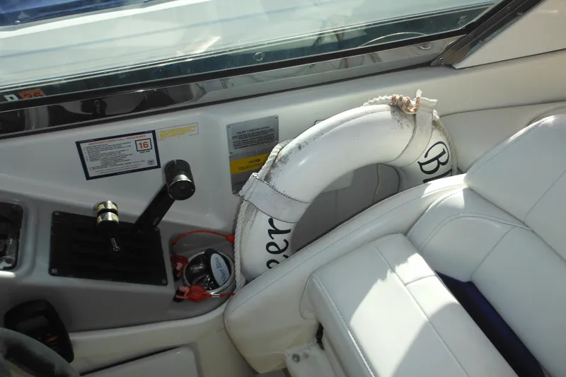 Slide: The Image of Interior of 2003 Formula 280 Bowrider boat with controls and life preserver. - 36