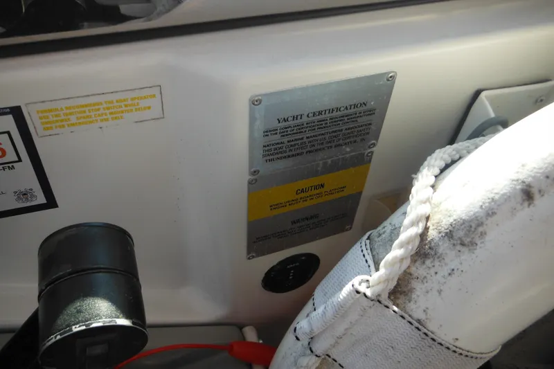Slide: The Image of 2003 Formula 280 Bowrider yacht certification and caution labels on interior panel. - 37