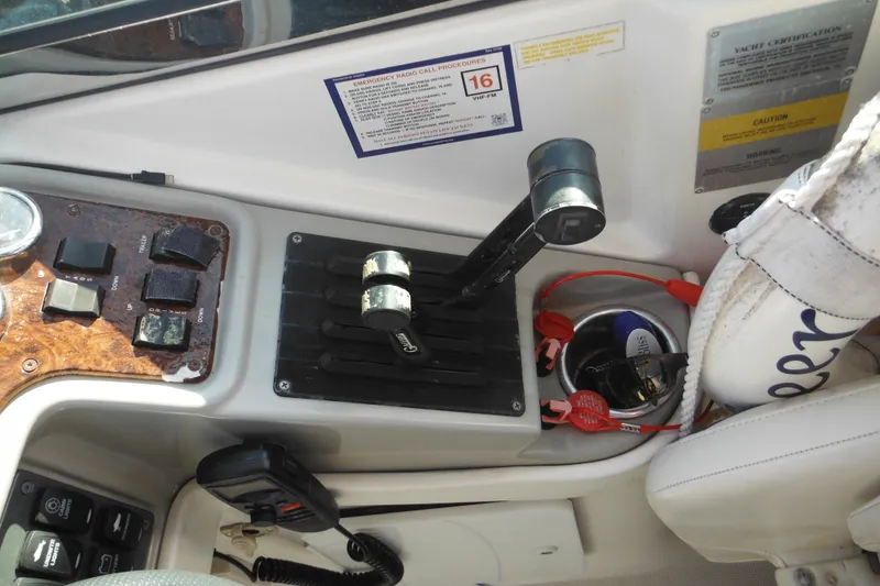 Slide: The Image of Control panel of a 2003 Formula 280 Bowrider boat with throttle and switches. - 38