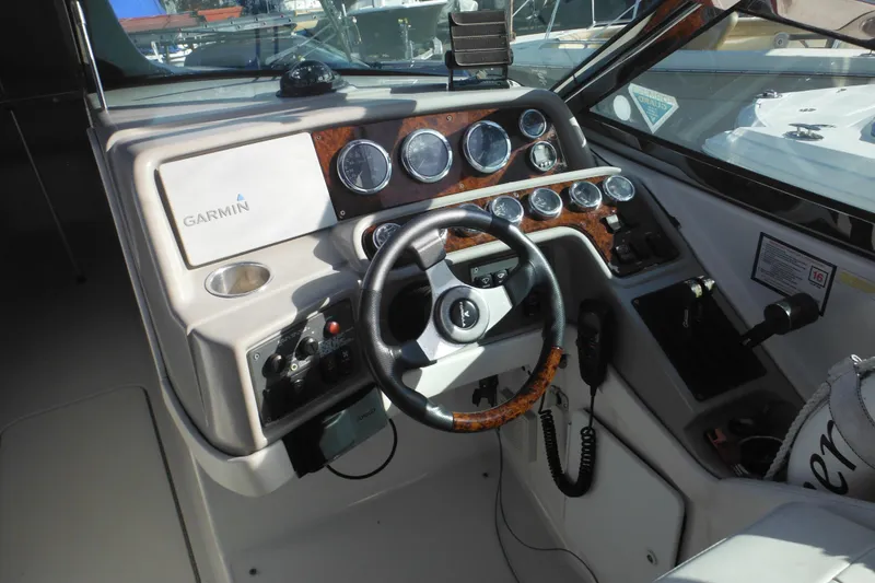 Slide: The Image of Cockpit of 2003 Formula 280 Bowrider with Garmin navigation system and steering wheel. - 39