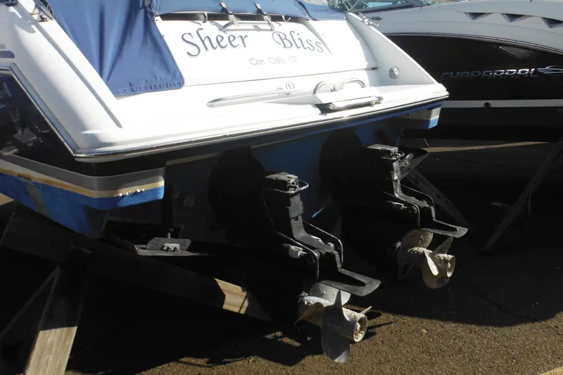 Slide: The Image of 2003 Formula 280 Bowrider boat with dual propellers, named "Sheer Bliss," on display. - 4