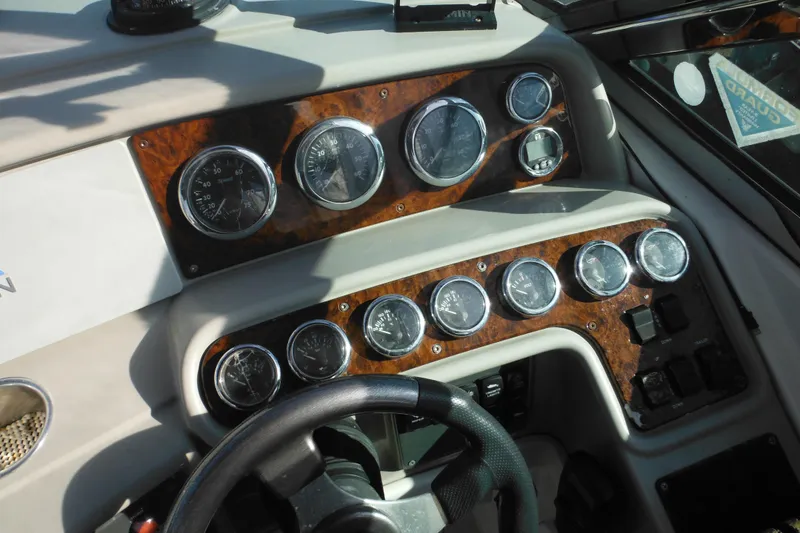 Slide: The Image of Dashboard of a 2003 Formula 280 Bowrider boat with multiple gauges and controls. - 40