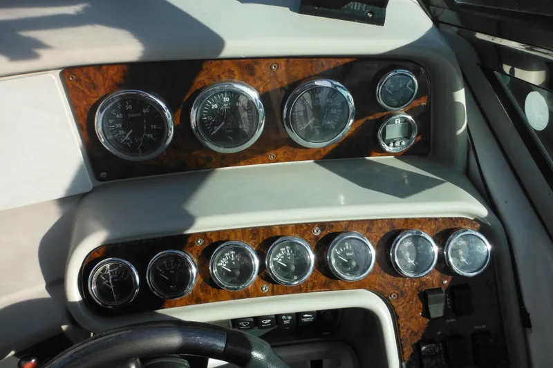 Slide: The Image of Dashboard of a 2003 Formula 280 Bowrider boat with multiple gauges and controls. - 41