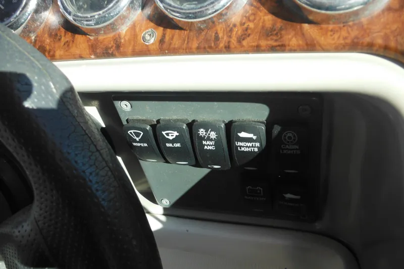 Slide: The Image of Dashboard controls of a 2003 Formula 280 Bowrider boat. - 42