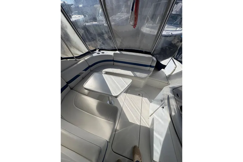 Slide: The Image of Interior of a 2003 Formula 280 Bowrider boat with seating and table. - 50
