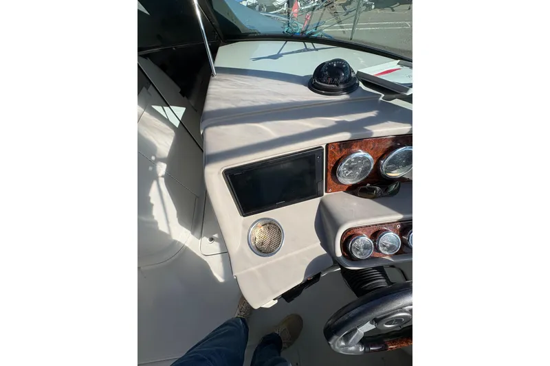 Slide: The Image of Dashboard of 2003 Formula 280 Bowrider boat with gauges and compass. - 52