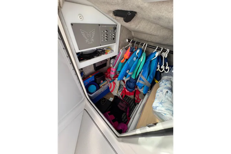 Slide: The Image of Interior of 2003 Formula 280 Bowrider with life jackets and storage area. - 59