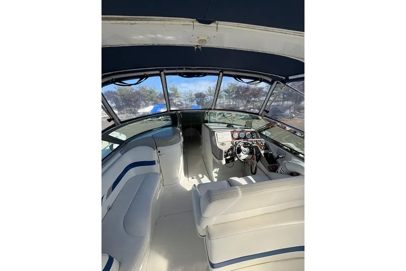Slide: The Image of 2003 Formula 280 Bowrider interior with white seating and modern dashboard. - 62