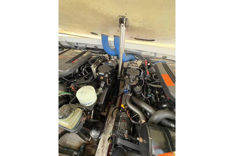 Slide: The Image of Engine compartment of a 2003 Formula 280 Bowrider boat, showcasing mechanical components. - 63
