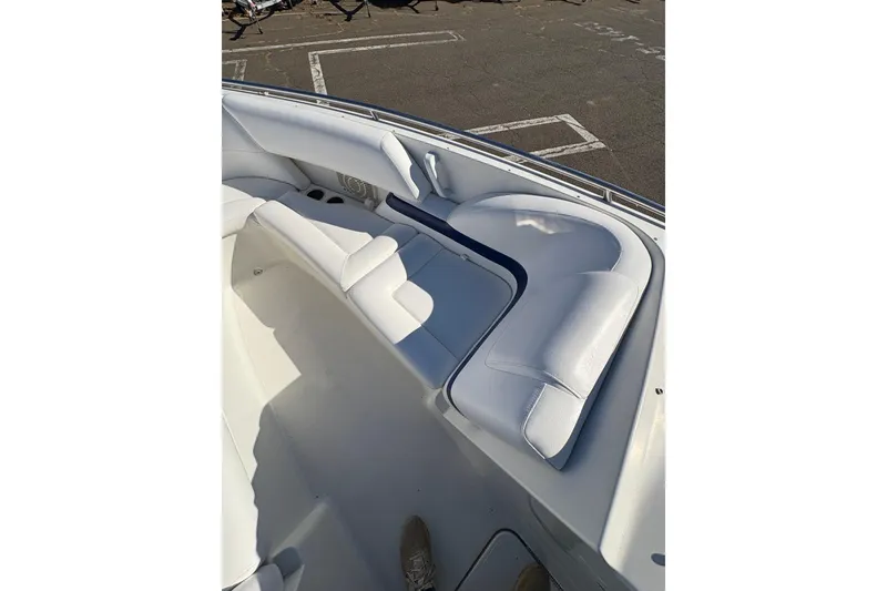 Slide: The Image of 2003 Formula 280 Bowrider boat interior with white cushioned seating. - 66