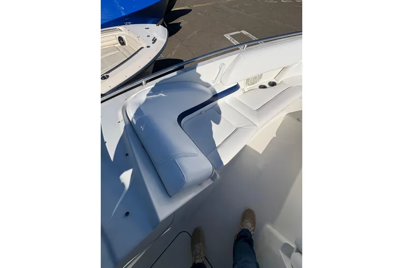 Slide: The Image of 2003 Formula 280 Bowrider boat interior with white seating and cup holders. - 67