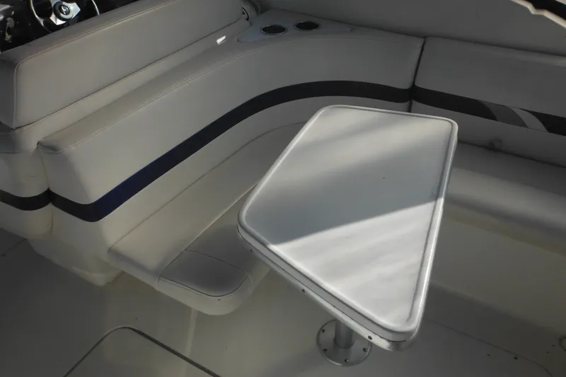 Slide: The Image of 2003 Formula 280 Bowrider interior with white seating and table. - 9