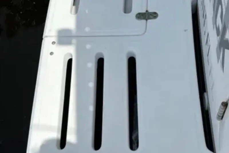 Slide: The Image of Engine compartment of a 2000 Tiara 37 Open with Caterpillar components. - 108