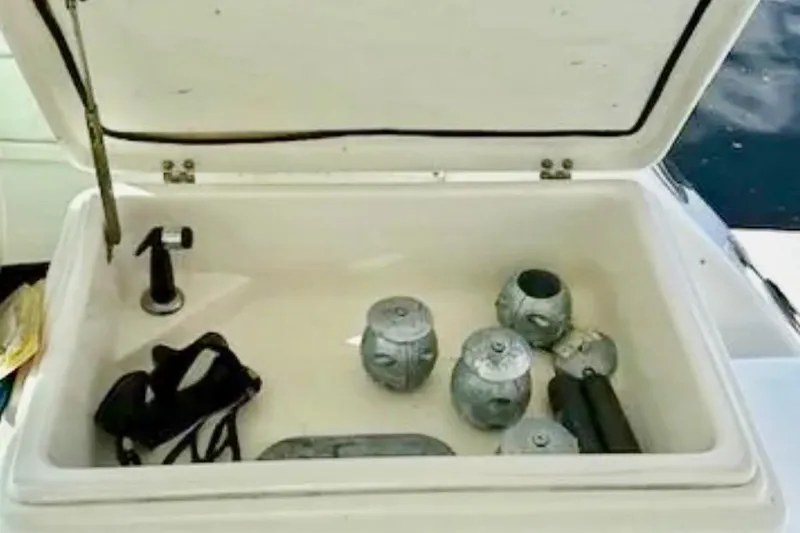 Slide: The Image of Engine compartment of a 2000 Tiara 37 Open boat, showcasing mechanical components. - 111