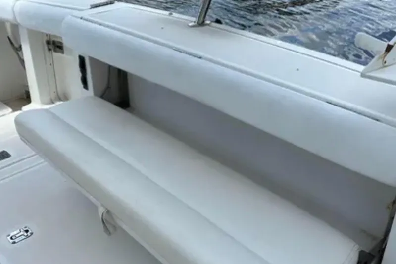 Slide: The Image of Interior of 2000 Tiara 37 Open yacht with cozy seating and wooden accents. - 27
