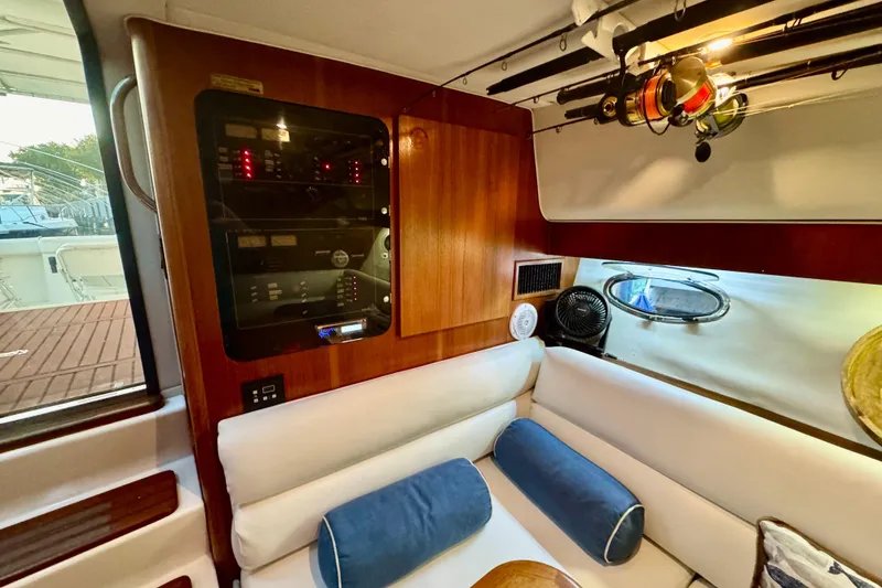 Slide: The Image of Mini fridge stocked with beverages inside a 2000 Tiara 37 Open yacht. - 39