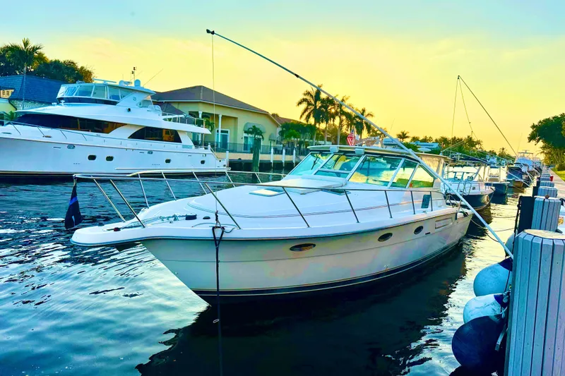 Slide: The Image of Open storage compartment on 2000 Tiara 37 Open boat with diving gear and weights. - 89