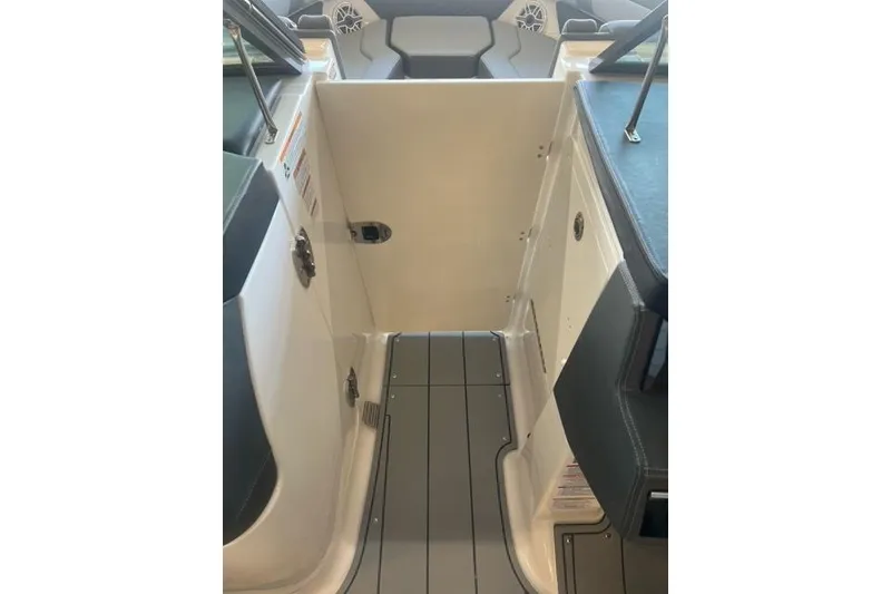Slide: The Image of 2025 Chaparral 267 SSX boat interior with sleek seating and modern design. - 11
