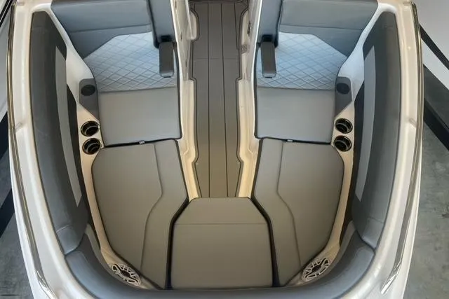 Slide: The Image of 2025 Chaparral 267 SSX boat interior with sleek gray seating and modern design. - 2