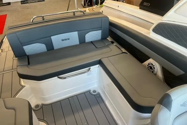 Slide: The Image of 2025 Chaparral 267 SSX boat interior with gray seating and SSX logo. - 20