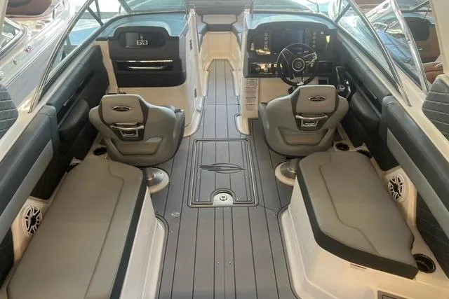 Slide: The Image of Interior of 2025 Chaparral 267 SSX boat, featuring sleek seating and modern dashboard. - 22