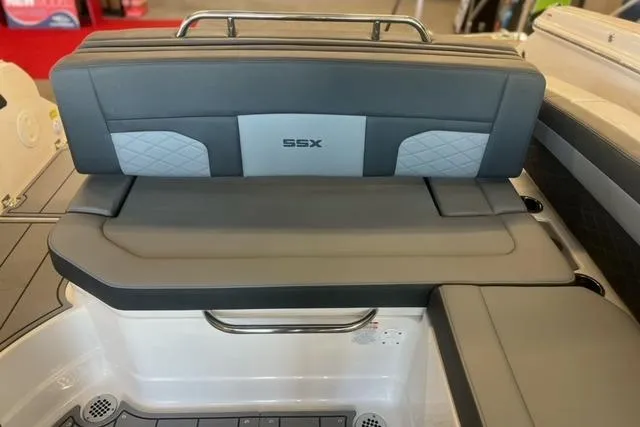 Slide: The Image of 2025 Chaparral 267 SSX boat interior with gray seating and SSX logo. - 25