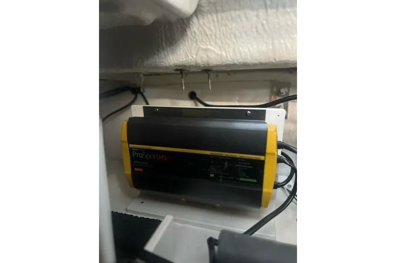 Slide: The Image of Battery charger in 2025 Chaparral 267 SSX boat engine compartment. - 35