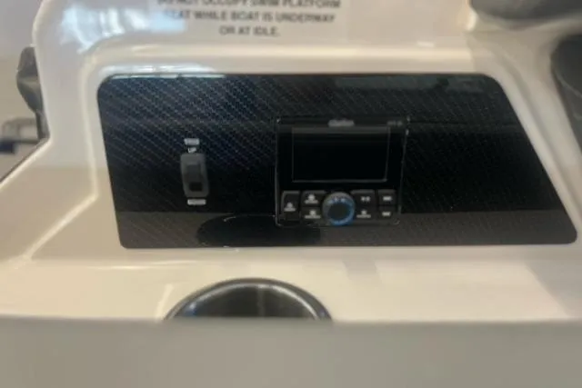 Slide: The Image of Control panel of 2025 Chaparral 267 SSX boat with modern audio system. - 38