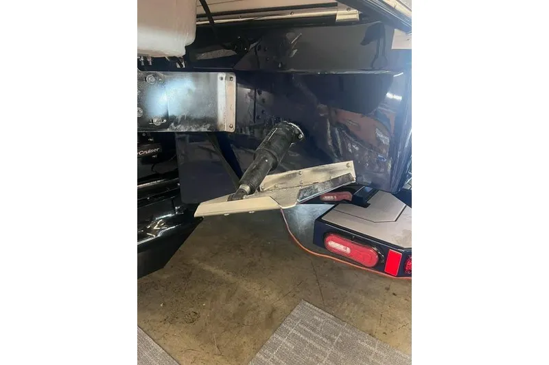 Slide: The Image of 2025 Chaparral 267 SSX boat stern with trim tab and outdrive detail. - 40