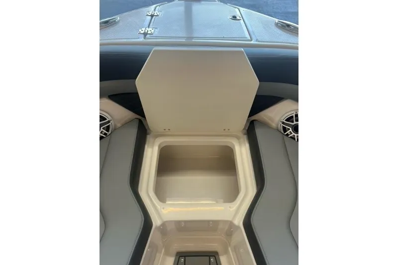 Slide: The Image of Open storage compartment on 2025 Chaparral 267 SSX boat interior. - 5