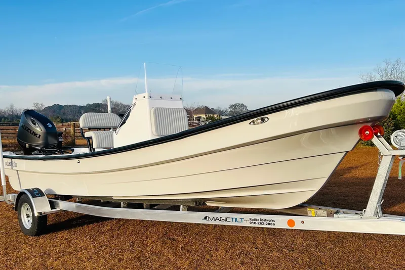 The Image of 2025 Panga Eduardono Panga 22 boat on trailer, featuring Suzuki outboard motor. - 1