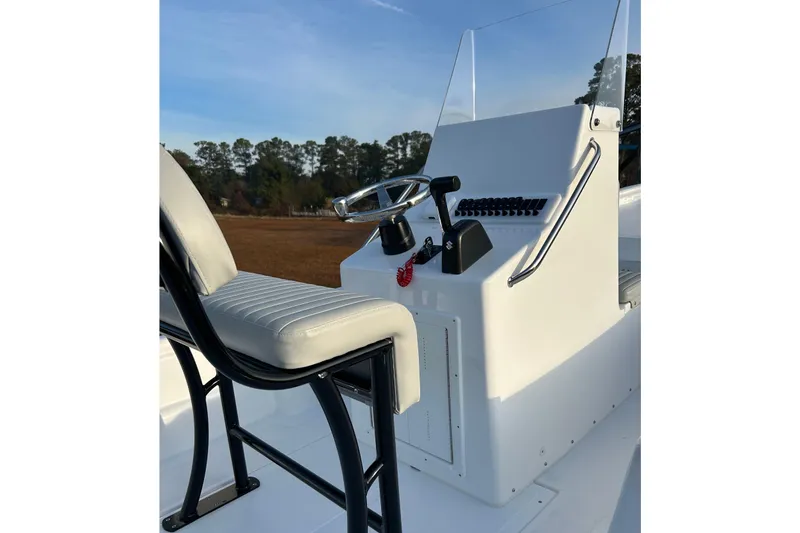 Slide: The Image of 2025 Panga Eduardono Panga 22 boat console with steering wheel and seat. - 4