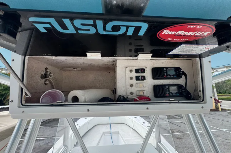 Slide: The Image of Center console of a 2006 Dusky 278 boat with steering wheel and navigation equipment. - 15