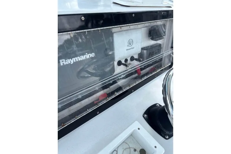 Slide: The Image of Control panel of a 2006 Dusky 278 boat with navigation and communication equipment. - 17