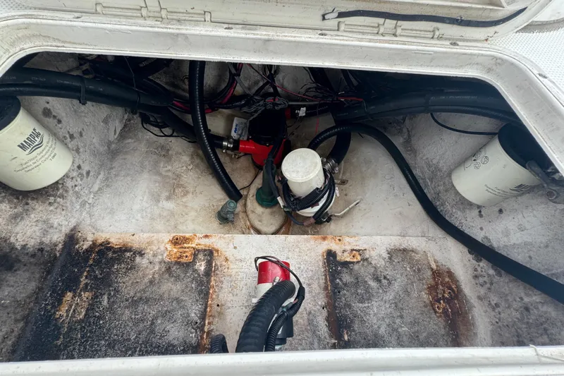 Slide: The Image of Anchor and rope stored in a compartment of a 2006 Dusky 278 boat. - 35