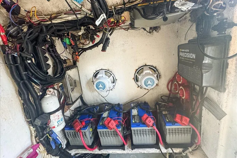 Slide: The Image of Electrical system of a 2006 Dusky 278 boat with batteries and wiring. - 62