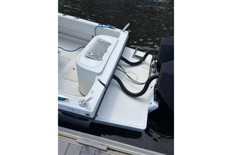 Slide: The Image of 2006 Dusky 278 boat interior with white console and stainless steel railings. - 9