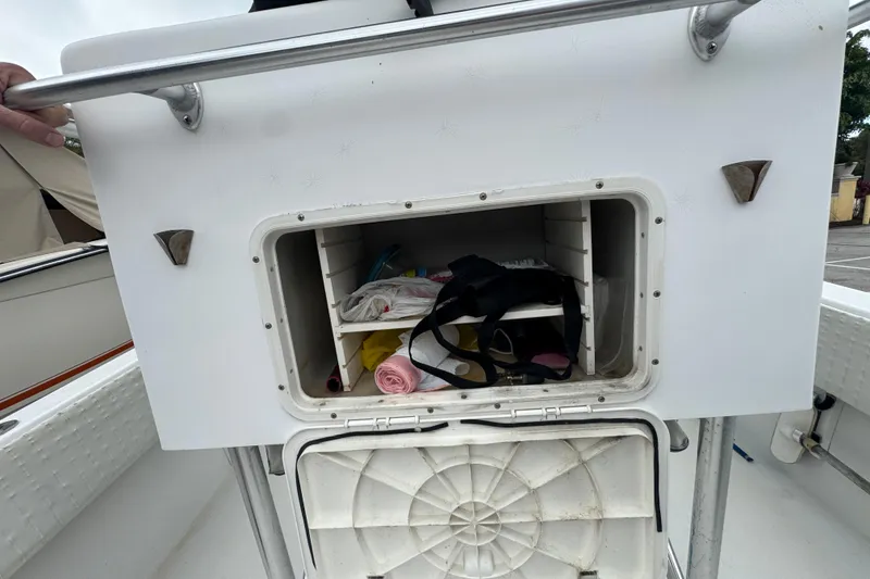 Slide: The Image of T-Bag storage on 2006 Dusky 278 boat, under-seat view with metal supports. - 11
