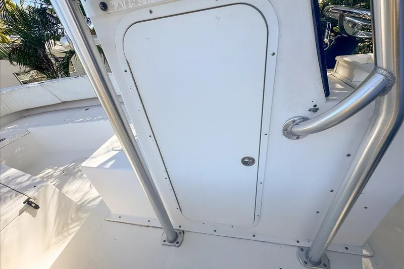 Slide: The Image of 2006 Dusky 278 boat interior with white door and metal railing. - 59