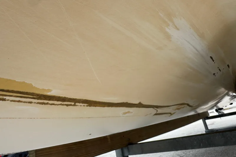 Slide: The Image of Close-up of 2006 Dusky 278 boat hull with visible wear and scratches. - 67