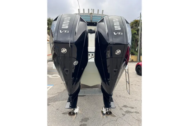 Slide: The Image of Twin Mercury 225 V6 outboard engines on a 2006 Dusky 256 boat. - 69