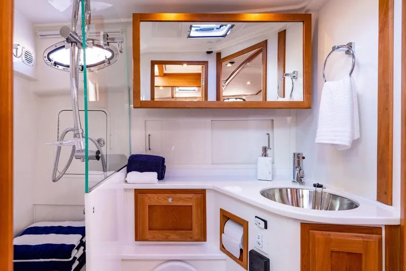 Slide: The Image of Luxurious interior of 2026 Back Cove 372 yacht with elegant seating and modern helm. - 10