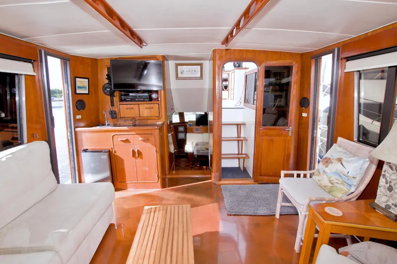 Slide: The Image of Interior of 1985 Gulfstar 44 Motor Yacht with cozy seating and entertainment area. - 26