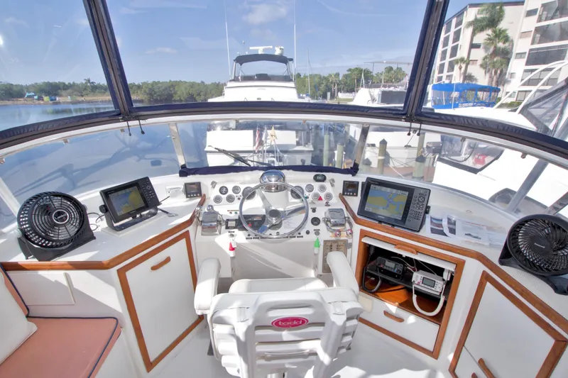 Slide: The Image of Cockpit of 1985 Gulfstar 44 Motor Yacht with navigation equipment and steering wheel. - 32