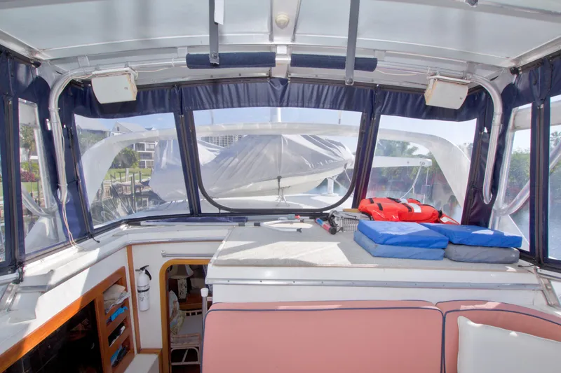 Slide: The Image of 1985 Gulfstar 44 Motor Yacht interior with cushions and life jackets on deck. - 35