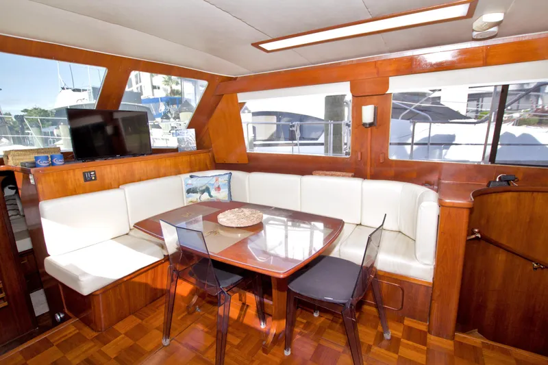 Slide: The Image of Interior of 1985 Gulfstar 44 Motor Yacht with dining area and large windows. - 40