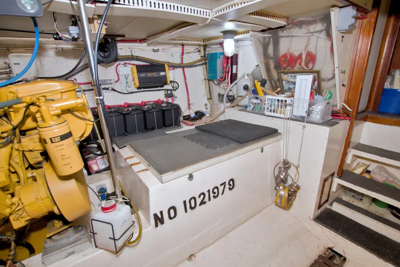 Slide: The Image of Engine room of 1985 Gulfstar 44 Motor Yacht with equipment and storage. - 78