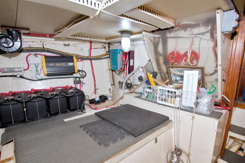 Slide: The Image of Engine room of 1985 Gulfstar 44 Motor Yacht with tools and equipment. - 79