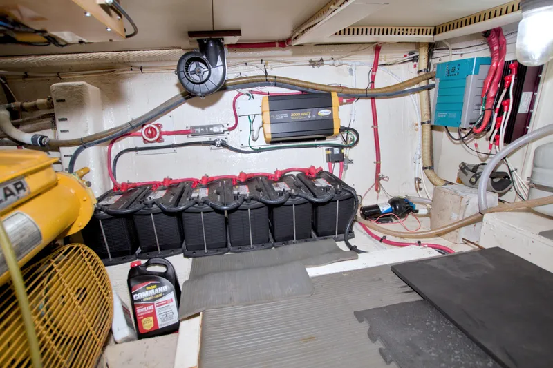 Slide: The Image of Engine room of 1985 Gulfstar 44 Motor Yacht with batteries and wiring. - 80